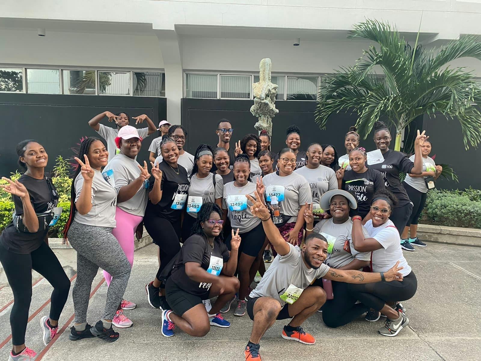 Employees from Team Jamaica posing for a group shot at an employee event.