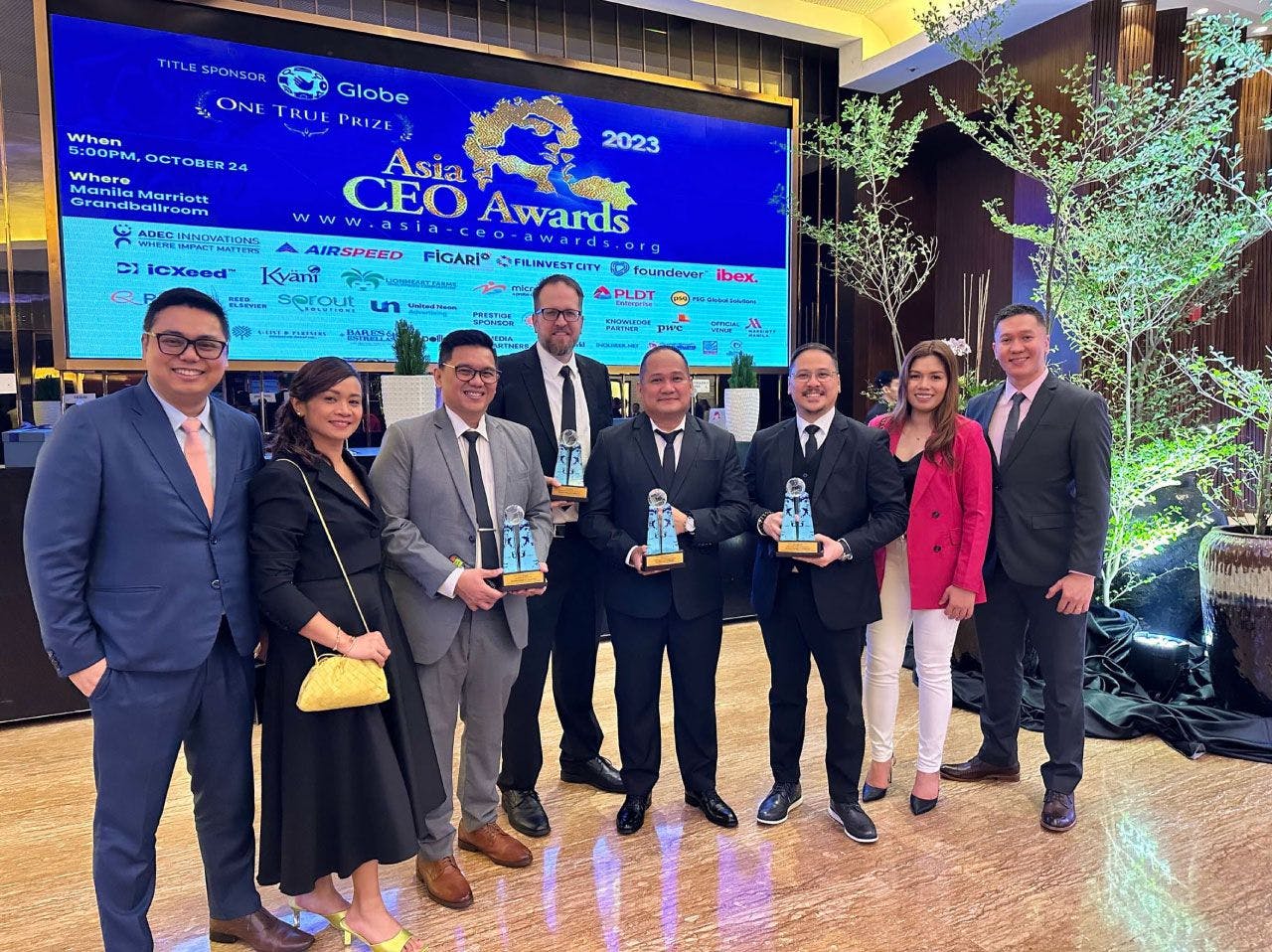 VXI Leadership at accepting award at Asia CEO Awards event.